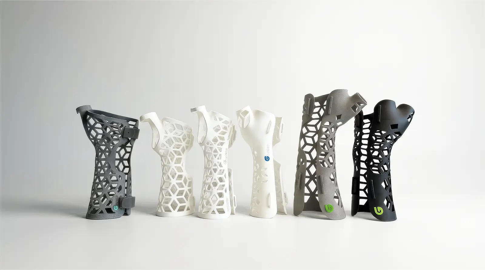 A row of printed Gero3D casts in grey, white and black