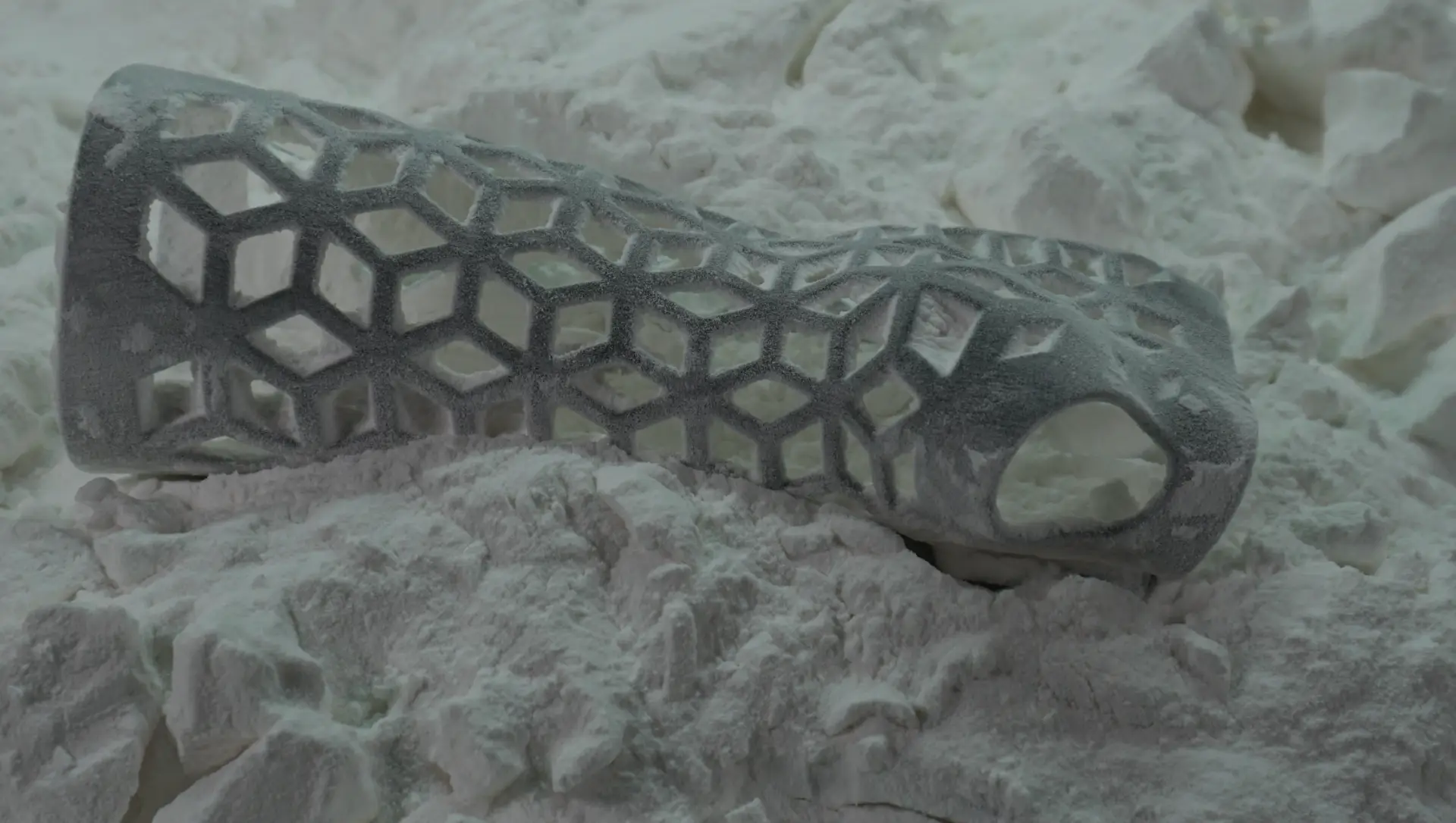 A Gero3D cast in the printer's powder bed, just after printing